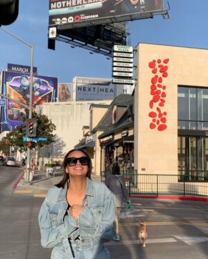 Ashley Nicole Williams Instagram - so I ironically wore the same jean outfit 2 1/2 years ago in front of our first billboard as I did in front of our last. and boy has baby grown. if I could hug that girl and hold her tight, say ya did it kid. 3 seasons as a lead on a tv show. I’m so proud of you. proud of us. cheers to these final episodes, cheers to 4 years of making this show and 3 wildly beautiful seasons, and cheers to leaving a mark on anyone and everyone who loves our show as much as we do. This final season is and always will be for you guys. See u tonight for episode 6. Goddess protect. 🤍 AB