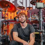Ashton Irwin Instagram - Watch Ashton Irwin breaking down some of his favorite 5SOS drum parts! 👊🏼 From conceptualizing the live shows and crafting merchandise, Ashton explains how the band members’ involvement goes beyond playing their instruments. But what truly sets him apart is his incredible ability to sing while drumming, a feat that’s not just about musical talent but also demands exceptional independence, fitness, and a unique focus on vocal support. 🎤 Click the link in our bio to watch the full #DrumeoBackstage interview where he talks about his early inspiration for playing the drums and how he got started at a young age, drawing inspiration from bands like The Police and Led Zeppelin. 🎬 @ashtonirwin @5sos #5SOS #5SecondsOfSummer #5SOSFam #5SOSFamily #5SOSFans #AshtonIrwin #5SOSDrummer #Drumeo #DrumLife #Drummer #Drumming #DrummingPassion #LukeHemmings #CalumHood #MichaelClifford #Youngblood #5SOSMusic #5SOSLyrics #5SOSConcert #5SOSLive #5SOSMerch #5SOSUpdates #5SOSAlbum #5SOSArt #5SOSFandom #5SOSInfection #5SOSHeartbreak #5SOSTour #5SOSPhotography Budweiser Stage