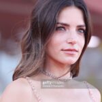 Aurora Ruffino Instagram - Quest’anno ho avuto l’occasione di partecipare all’ 80ª edizione del Festival del Cinema di Venezia per presentare la mini serie “The Red Rail” prodotta da @campari.it e realizzata in collaborazione con il @csc_scuolanazionaledicinema È stato bello tornare al centro sperimentale di cinematografia per girare questo progetto destinato a supportare gli studenti e i futuri talenti del cinema. Un grazie speciale a @campari.it @pronovias @messika @aquazzura @cotrilspa @armanibeauty @maxmontingelli @sgpitalia #venezia80 #labiennale #camparicinema #redpassion