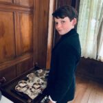 Benjamin Evan Ainsworth Instagram - Wow! The Sandman is the #1 show in 34 countries! Who’s watched it? If not, make sure to catch it this weekend! It was an amazing experience to play Alex Burgess in the pilot episode with such an incredible cast. Swipe across for a few behind-the-scenes pictures from my time on the shoot. #thesandman