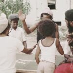 Bob Marley Instagram - A rare look : Alvin ‘Seeco’ Patterson , #BobMarley, Antonio ‘Gilly’ Gilbert and brethrens play dominoes at 56 Hope Road . Late 1975 Growing up there was always games being played on the spot , dominoes, football, table tennis, whatever. “Bob love any kinda game where him can win “ 🤣 @ziggymarley #games #yardlife #kingston #jamaica 📷 by @nevillegarrick ©️ Fifty-Six Hope Road Music Ltd. 56 Hope Rd, Kingston, Jamaica.