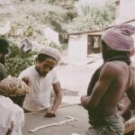 Bob Marley Instagram - A rare look : Alvin ‘Seeco’ Patterson , #BobMarley, Antonio ‘Gilly’ Gilbert and brethrens play dominoes at 56 Hope Road . Late 1975 Growing up there was always games being played on the spot , dominoes, football, table tennis, whatever. “Bob love any kinda game where him can win “ 🤣 @ziggymarley #games #yardlife #kingston #jamaica 📷 by @nevillegarrick ©️ Fifty-Six Hope Road Music Ltd. 56 Hope Rd, Kingston, Jamaica.