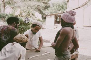 Bob Marley Instagram - A rare look : Alvin ‘Seeco’ Patterson , #BobMarley, Antonio ‘Gilly’ Gilbert and brethrens play dominoes at 56 Hope Road . Late 1975 Growing up there was always games being played on the spot , dominoes, football, table tennis, whatever. “Bob love any kinda game where him can win “ 🤣 @ziggymarley #games #yardlife #kingston #jamaica

📷 by @nevillegarrick 
©️ Fifty-Six Hope Road Music Ltd.