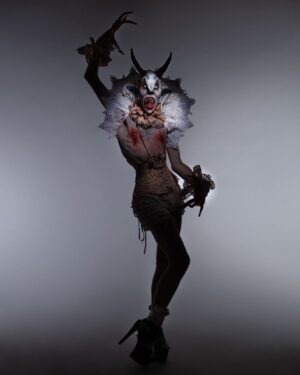 Charity Kase Instagram - The creature stepped into the moonlight, beady eyes twinkling, long fingers twitching. 

Photo by @lukenugentstudio 
Collar by @videnoircouture 

#dragmonster #halloween