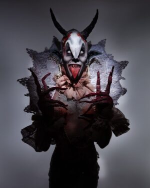 Charity Kase Instagram - The creature stepped into the moonlight, beady eyes twinkling, long fingers twitching. 

Photo by @lukenugentstudio 
Collar by @videnoircouture 

#dragmonster #halloween