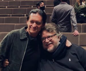 Clifton Collins Jr. Instagram - Getting schooled ! Big ol happy birthday to this legend, @gdtreal . Both a gift to cinema and humanity, for these stories teach compassion , empathy , patience , all human traits that as a whole we seem to be stepping so far away from. We all have stories to tell, and they are often daunting, for the fear of addressing the pain in one’s story is very real , and deeper than one can even imagine, paralyzing at times. I personally don’t know how I would have began this journey if not for Guillermo one evening sitting me down, telling me , that not only I CAN do it, but that I MUST!  Am forever grateful for the love n mentorship ! Some dear fam is some of these @realmikejudge @cheechmarin ❤️🙌