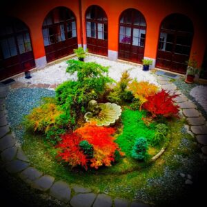 Crispin Glover Instagram - From a different corner of the second floor hallway is a different view of the fountain in the courtyard from the previous photo.  It seems like the fountainhead is an older, possibly renaissance era, lion’s head sculpture that was placed on top of a baroque style shell shape basin. Zamek Konarovice Czech Republic
