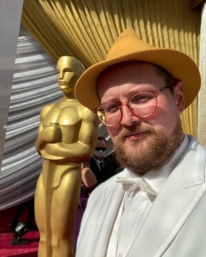 Dan Deacon Instagram - Went to the Oscars and walked the red carpet with the @ascensiondocumentary team! 

Brief and incomplete summary of highlights: 
It was bonkers. 
-Anthony Hopkins told me he liked my hat. 
-Met Bill Murray and I could hardly speak. 
-The chocolate Oscar’s at the Afterparty are coated in a gold glitter that gets on everything you touch. 
-They do not want you to take table cloths home and ask you to put it back if you try to wrap up a chocolate Oscar in it so you stop getting gold powder on everything. 

Thanks to event who sent me pictures when they spotted my hat on TV.

THANK YOU so much to @jk_or_am_i for including me on the team for Ascension and having such a brilliant and unique vision!!!! I love this film. I love working with you and I am so beyond excited to see what you create next!!!

Congrats to the whole team! It was amazing to celebrate how far this super weird movie has made it. 

Congrats to @questlove and the whole Summer Of Soul team for your well deserved win!

Ok flying to join back up with the @futureislands tour. See you soon Dublin! Thank you so much to all of you for your support in my weird life ❤️