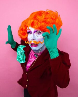 Daniel Wallace Instagram - Eye spy with my little eye something beginning with #FABULOUS
Had so much fun gender bending and creating a colourful christmassy queer chap to model @florencias_wigs fabulously festive wig and tasche combo!(I believe they are releasing a new range very soon!)photo by @faketrashstudio also check out the cute jacket I found in @oxfamoriginals 
#Victorian #orange #pink #Greencarnation #Camp #Christmas #Drag #dragqueen #Dragking #Lovelytime