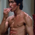 Danny Ramirez Instagram - “Yo Julius, what should I aim for?” - Me “… Bruce Lee” - Julius I’ll never move and look like the GOAT Bruce Lee, but took that as a challenge and these last 3 1/2 months training like an athlete and a martial artist have been a childhood dream. Shout out to @nicshimonek and @mrdrewss for everything through the process. A long way to go from our goals but feeling great about the progress this morning.