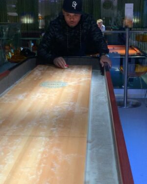 David Yost Instagram - Forever in Our Hearts! Hard to believe it’s already been one year.
These videos are from when @jdfffn , @walterejones & I were in Belgium…just playing shuffleboard. “A little sand for good luck.” Walter was the only one who stayed on the board.