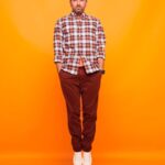 Derek Muller Instagram - Hey! I’m on TikTok @veritasium🤷🏻‍♂️ Things have been a bit up in the air but always good to try new things including when Youtube said orange was my color and they wanted to take studio portraits so here we are. Thanks to photographer @eccles