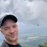 Diplo Instagram - landed in Nairobi got an uber to Mount Kilamanjaro, realized it’s in Tanzania so we went to this other mountain with some cows. climbed with some friends met some country music fans listened to the hum of windmills , pet some more cows got bit by fire ants drank sugarcane and then took a nap .. Come to Africa it’s beautiful 🌍🇰🇪 Nairobi, Kenya