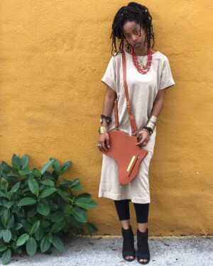 Donisha Rita Claire Prendergast Instagram - Reminder to self: Stay #undefined. Our Identity as Africans in the diaspora is a thing that instigates a lot of questions. Conversations that try to evaluate ‘well, exactly how African are you?’ Maybe, Maybe, Maybe it’s the kink in my hair, or the clothes I choose to wear. Or maybe it’s the tone of my skin, or what happens to my DNA when I hear Africans sing. Maybe, Maybe, Maybe it’s the curve of my hips, or the shape of my nose and my lips. Or the fact that my ancestors were apart of Kingdoms on the continent before we were stolen away as chattel on a ship. How African are you? Be what it may, whatever it is, it comes from within, and lives without external opinion. A simple truth... We are not African because we are born in Africa. We are African because Africa is born in us. May that Be enough #ghana #jamaica #belove #africandiaspora #eachoneteachone #africaunite #healnothurt #wewillrizetogether 📸@ahutchphoto
Africa bag, with materials sourced and manufactured in East and West Africa, designed by @orijinculture. Bridge the gap #supportblackbusiness #buildcomeunity