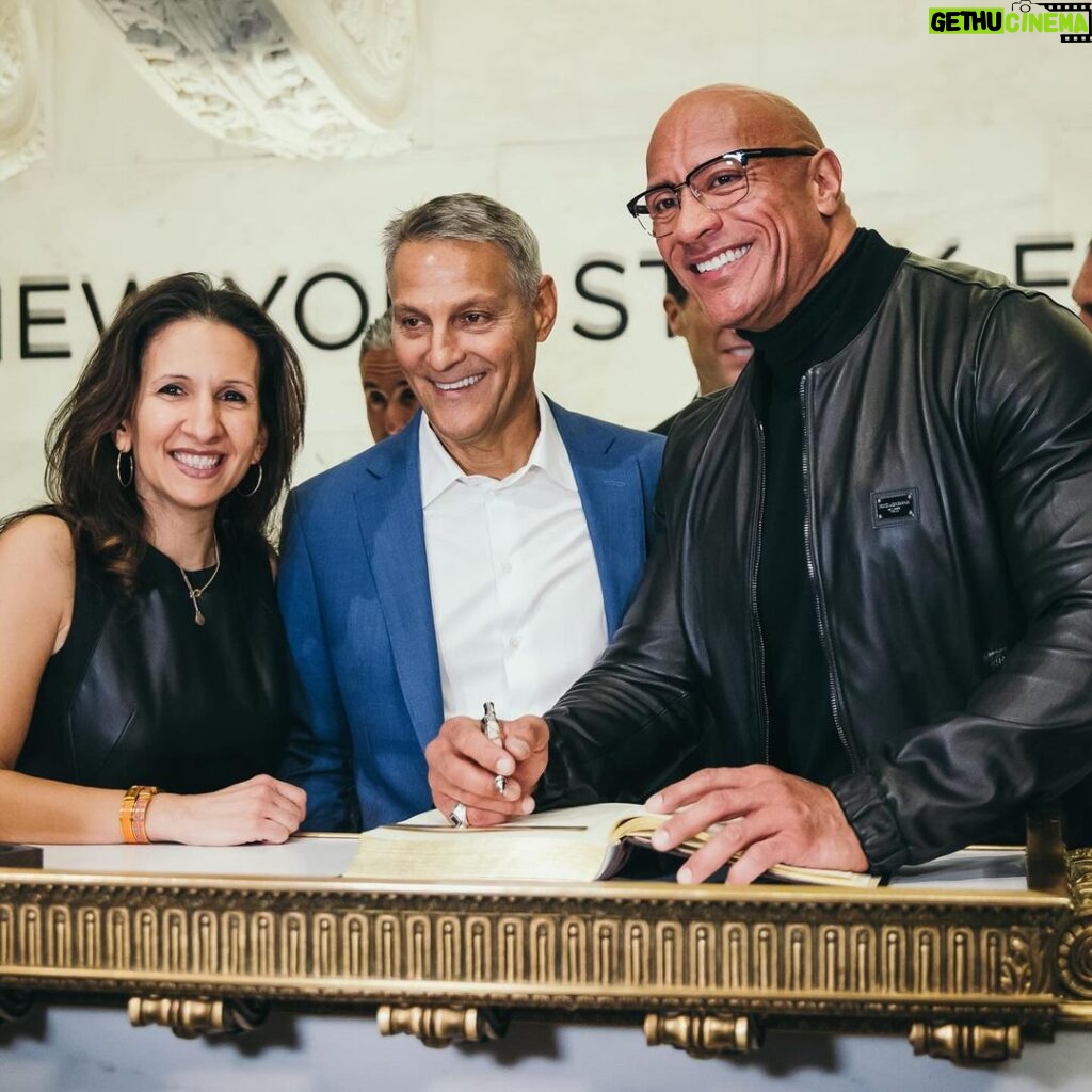 Dwayne Johnson Instagram - From $7 bucks to this surreal day. Crazy. Thank you @nyse for the incredible & very warm welcome. Honored to join the Board of Directors for @tkogrp and honored to ring the iconic bell to open our market. Let’s get to work. @wwe @ufc #peopleschamp @thisisamandaw 📸