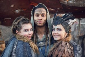 Eleanor Worthington-Cox Instagram - BRITANNIA III IS HERE !!! If you’ve already binged the entire series (like any sane human would), here are some pictures of the mucky little chosen one and lots of people I love to cheer you up… if you haven’t… DO IT NOW. 😈

Oh and keep your eyes peeled for even more cheeky BTS pics to come 👀 

#BRITANNIAIII #BRITANNIA3 @skytv @vertigo_films @britannia_tv
