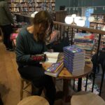 Elif Şafak Instagram - Wishing you all a happy, peaceful and inspiring New Year full of love and books. Long live libraries and bookstores @toppingsbath #bookshopsoftheworld #bookstorelove #booksarelife #writersandpoets #theislandofmissingtrees #elifshafak #bookloversunite #thefortyrulesoflove #thebastardofistanbul #10minutes38secondsinthisstrangeworld #knittedgloves 📚📚📚 herkese hepimize sevgi mutluluk ilham dolu, kitaplar ve aşkla örülü güzel bir sene diliyorum