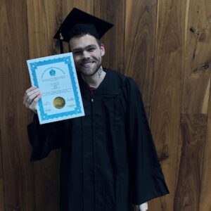 Elijah Daniel Instagram - WE DID IT. WE GOT OUR PhD’s. THEY SAID WE WERE TOO DUMB BUT GUESS WHAT BISH WE GRADUATES!!!!! 🖤🖤🖤 @awstenknight
