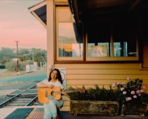 Ella Hooper Instagram - Just a girl, waiting on a train, (and that’s not just some country song bs to me, as you know I travel by train, all, the, time..) waiting for you to book tickets to my show w. @ramblinvanwalker at @thebridgehotelcastlemaine on Saturday! 💋💋💋 picturesque pic by my old pal @w_i_l_k #violetskies #violettown #trainstation #ohmygoddess #onelastshow