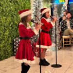 Emmy Buckner Instagram - Once upon a December, I hosted my first ‘Holiday Concert and Celebration’ filled with nearly 20 performances, crafts, games, a cookie decorating station, a hot chocolate bar, a photo booth, and of course, a bar for the adults 🥂 It was truly one of the best nights of 2023 and encompassed what the holiday season is all about. These kiddos came to me, weeks after delivering baby Cayden, and had their lessons in his nursery. Cayden was often involved as an audience member- lol. These photos and videos are just a SMALL glimpse of the night. I will NEVER forget when Baby Cayden came out as Baby Santa and surprised us all and the support and love from the audience! 🥹🎄 What I get to do for “work” is magical. I want to thank my community of students and their families for making this “idea” a reality❤️ I want to thank Mr. Max for assisting with set, sound, food, the kids, everything- love you @maxchucker !! @violetcactusvenue thank you for letting us rent the space and host the event here- it was perfect! And thank you Tina for all the help and whipping out those merry margaritas!! 🍹 And thank you Aunt Shelby @shelbywulfert for getting Baby Santa there safely and always being there for us -we love you! 💋 Violet Cactus Studio