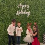 Emmy Buckner Instagram - Once upon a December, I hosted my first ‘Holiday Concert and Celebration’ filled with nearly 20 performances, crafts, games, a cookie decorating station, a hot chocolate bar, a photo booth, and of course, a bar for the adults 🥂 It was truly one of the best nights of 2023 and encompassed what the holiday season is all about. These kiddos came to me, weeks after delivering baby Cayden, and had their lessons in his nursery. Cayden was often involved as an audience member- lol. These photos and videos are just a SMALL glimpse of the night. I will NEVER forget when Baby Cayden came out as Baby Santa and surprised us all and the support and love from the audience! 🥹🎄 What I get to do for “work” is magical. I want to thank my community of students and their families for making this “idea” a reality❤️ I want to thank Mr. Max for assisting with set, sound, food, the kids, everything- love you @maxchucker !! @violetcactusvenue thank you for letting us rent the space and host the event here- it was perfect! And thank you Tina for all the help and whipping out those merry margaritas!! 🍹 And thank you Aunt Shelby @shelbywulfert for getting Baby Santa there safely and always being there for us -we love you! 💋 Violet Cactus Studio