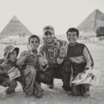 Enrique Iglesias Instagram - #TBT this was one of those unforgettable days… we almost didn’t make it in time to see the pyramids and ran into these kids with smiles a mile wide… they made this moment unforgettable.  Still one my favorites of all time ✌️ The Great Pyramids Of Egypt