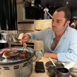 Florence Pugh Instagram - Things we learnt on our day in Tokyo.. Toby wore black jeans and regretted it. Hot. I’m finding it hard to say no to the clothes. The trees are magical and look like they can talk. It wouldn’t surprise me if you told me they can. The food is literally bursting at the seams with flavour. All I need for breakfast, lunch and dinner is dumplings. The fruit here doesn’t taste like fruit, it’s fruit squared. If I could hand deliver a single grape (oh my god the grapes here 😱) to everyone I would but I can’t and they’ll probably squish in the travel. I need another suitcase because I can’t leave things behind at the stalls. I packed wrong. High waisted jean shorts- nope. Next time= more floaty floaty things. The people here are the kindest and the purest. I want to cuddle everyone but I won’t because even though they’re kind I’m also a stranger. If there’s a gap in the buildings, you know they’ll build a cute adorable Polly pocket building that fits perfectly. I want to bathe in noodles. We cooked some hearts and some cocks and called it a night. Jet lag. Is. A. Bitch. Nothing a grape can’t fix.