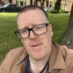 Frankie Boyle Instagram - Back from holiday and writing under a tree, as the Lord intended. That little thing on my throat turned out to be a bit of leaf, and not a Coco Pop, or whatever you were imagining