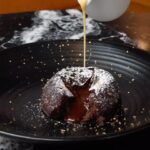 Gordon Ramsay Instagram – Gooey Christmas pudding chocolate fondant with brandy custard at @breadstreetkitchen !! Bread Street Kitchen