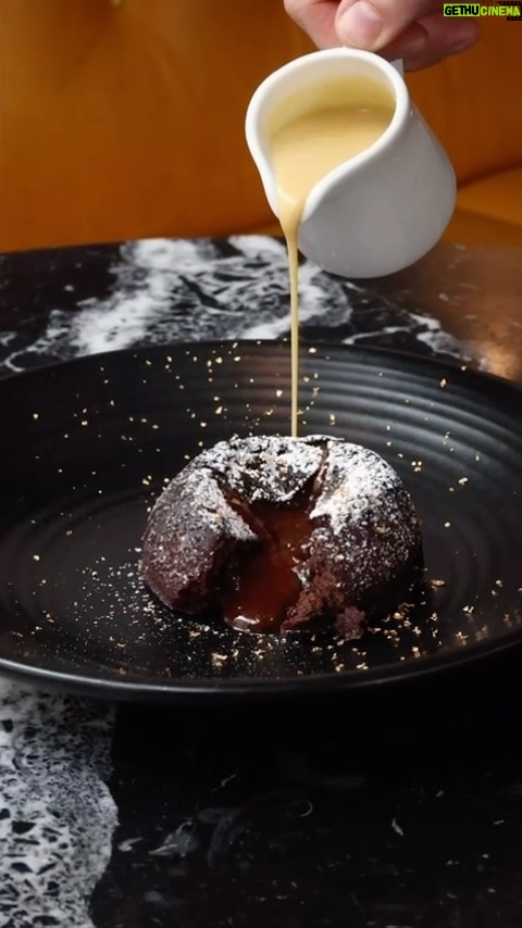 Gordon Ramsay Instagram - Gooey Christmas pudding chocolate fondant with brandy custard at @breadstreetkitchen !! Bread Street Kitchen