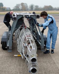 Guy Martin Instagram - After more than a decade in design and build @the_52_express land speed record motorcycle successfully completes its first ever powered run. Ridden by Guy Martin, a sub 90mph test at Elvington Airfield, Yorkshire, enabled the team to carry-out a number of systems and safety checks, establish braking distances and also saw the bike lift up from its stabilisers to run on its own two wheels. Streamlined bodywork will soon be fitted over the 30ft labyrinth of aero-grade metal tubing. The motorcycle is powered by a fifty-year-old Rolls-Royce helicopter engine slung behind a 1950s-style cockpit . It is the creation of 77-year-old former motorcycle Grand Prix and TT sidecar racer, Alex Mcfadzean. Ridden by Guy Martin, it is hoped the all British bike will hit 400mph, breaking the current 376mph motorcycle land-speed record, in Bolivia in 2023. The 52 Express - Land Speed Record Motorcycle Guy Martin @horiba.mira @demontweeksmotorsport @bellhelmets @project100comms Vulkoprin nv Dsg Apicom @ompracing Antigravity Batteries Néos Firetrace Life Racing. Full details and more photos available on the @the_52_express Facebook page. Images and words by the 52 express team