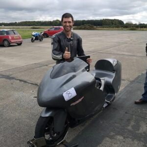 Guy Martin Instagram - May 2018 Project 300 was born. It’s first ever run did a respectable 183.044. June 2019 Guy took to Elvington and did a 257.727. September 2019 another go and he came away with a personal best of 270.965. Back to the shed for the winter until the conditions were perfect to push for the big 300. Then we all went into lockdown. Yesterday Guy had the opportunity to go to an airfield (abiding by social distancing) and have a few practise runs and came away with a 274.76. He was delighted with a new personal best And he is unofficially the fastest man in the UK on a conventional motorcycle. Guy has realised the journey to 300 might take a bit longer. Finding that extra 25mph will be difficult but sure anything worth having does not come by easily! This is not a tv thing, this is just a personal project, think it was a tad too dangerous for them :) #project300 #guymartinracing #guymartin
