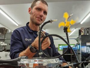 Guy Martin Instagram - It’s been awhile but he’s back. As an energy crisis and cost of living crisis collide Guy’s new series will investigate the past, present and future of British power stations to work out how the country makes its most valuable commodity of all: electricity.

Over the 3, hour long episodes Guy will be making his own spectacular contribution towards Britain's Net Zero goals, by helping to blow up a coal-fired power station.  He’ll be putting himself through an intense safety course and learning how to escape from an underwater helicopter so that he can work on the world's biggest offshore wind farm, then he'll work with the British Army in their brand new solar-powered workshop. Plus he'll be tasked with "the hardest job in the country" - manually making the second-by-second adjustments required to balance the nation's supply of electricity with its ever-changing demand. 

Guy will also drive to the very end of the National Grid - the Orkney Islands - and find out how the world's biggest tidal generator and a fledgling hydrogen economy are teaching the world about future fuels.  Additionally,  he’ll investigate what part nuclear has to play in keeping the country's lights on and will put in a shift at Hinkley Point C, the nuclear building site reputed to cost £7m a day to run.

“I’ve been telling the telly lot we need to do this series for ages. I've always been fascinated with power - making it, using it, tuning it, while at the same time trying to be efficient and not spend a fortune. And whether it's motorbikes or tractors, my house or power stations , the principles are the same. All the places we've had access to are trick, and getting stuck in alongside the people who work in them is bloody brilliant. The plan is to find out how power generation works, what the good bits are, what the problems are, and where our next bit of electricity is best coming from." 

Guys Power Trip Coming this autumn  on @channel4 #guymartin #powertrip #northonetv #channel4