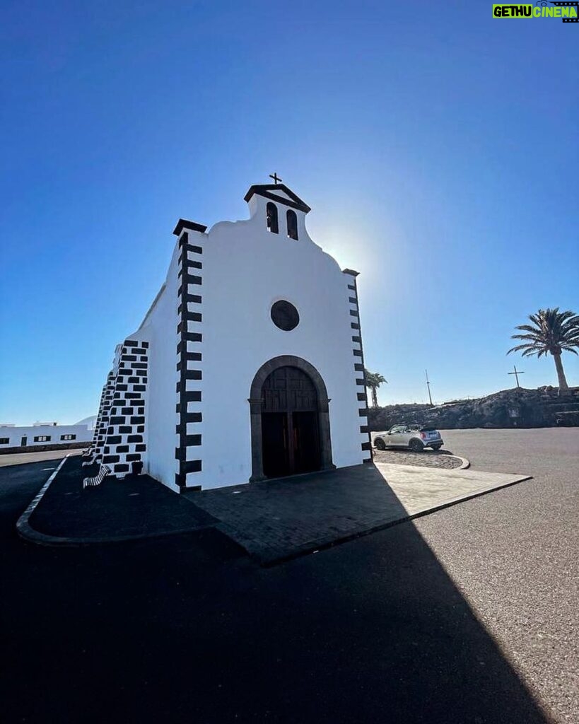 Hugh Wallace Instagram - Today we visited Ermita de Los Dolores, (Our lady of Sorrows) a modest 18th-century church with a rich history. The church has a single nave built in white stonework with black volcanic details. Its façade is crowned by a double gap belfry that serves as a bell tower, with a semi-circular arch across its entrance together with a small translucent oculus. All of this is presided over by a Catholic cross. Its most prominent element is its half-orange dome with a skylight in the centre. When I’m on holidays I love to visit places of interest, any other suggestions? #lanzarote #architecture Lanzarote, Canary Islands