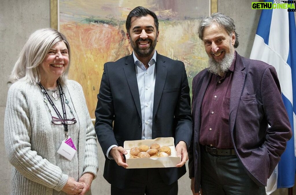 Humza Yousaf Instagram - Thanks to Ephraim and Margalit from the Scottish Council of Jewish Communities for bringing Giffnock's finest sufganiyah to @scotparl today, as #Hanukkah, the Jewish Festival of Lights, gets underway. A reminder, in spite of the darkness of recent times, of the power of light and of hope. Chag urim sameach! Scottish Parliament
