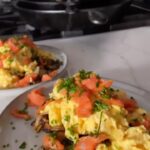 Hunter March Instagram - Would you eat this? Fun tip: There’s only one answer that won’t get you immediately blocked. The base is caramelized potatoes and onions with lots of salt, cooked in a cast iron and then finished in an air fryer for more crisp. While it’s in the air fryer I scrambled 8 eggs in a pan with only butter, then topped them with lox, green onion, finishing salt, and a drizzle of olive oil. Then I glared into the camera with pride, you have to glare into the camera with pride or it doesn’t taste the same. #breakfast #recipes #cooking Los Angeles, California