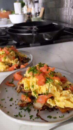 Hunter March Instagram - Would you eat this? Fun tip: There’s only one answer that won’t get you immediately blocked.

The base is caramelized potatoes and onions with lots of salt, cooked in a cast iron and then finished in an air fryer for more crisp. While it’s in the air fryer I scrambled 8 eggs in a pan with only butter, then topped them with lox, green onion, finishing salt, and a drizzle of olive oil. Then I glared into the camera with pride, you have to glare into the camera with pride or it doesn’t taste the same. #breakfast #recipes #cooking