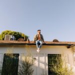 Hunter March Instagram - Frank’s getting bigger but he’s never too big to climb on the roof for a little shoot with his dad ❤️