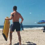 Hunter March Instagram - Chest may be small but my back is BACKING rn. Also pretend I’m holding a surfboard. Manhattan Beach, California