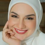 Irish Bella Instagram - 💗 @_irishbella_ 💗 "Empowerment is not just a word; it's a woman embracing her potential, standing tall in her authenticity, and shaping a future where every voice is heard." Make up by @erniaredberry Hijab do by @diah_amora7