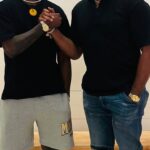 Israel Adesanya Instagram - “Apes together strong!” - Caesar I could tell yous a whole yarn about how this all happened, but it’s none of your business. This is between us, so just enjoy the moment. This sparked something in me…In young Izzy. Thank you @jonnybones ☠️ #fanofafan 👊🏾 Las Vegas, Nevada