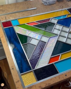 Ivy Winters Instagram - Hello everyone! I hope everyone has been staying happy and healthy this winter season!I’ve been pretty busy making stained glass panels and wanted to share with you my latest commission piece. It’s 31” by 21” with a fun range of colors, textures and square bevels. It has been recently installed in my clients laundry room (last picture). #stainedglass #leadwindow #lead #glass #glasscutter #beveledglass #art #window #handmade