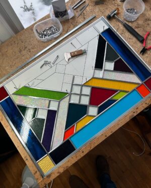 Ivy Winters Instagram - Hello everyone! I hope everyone has been staying happy and healthy this winter season!I’ve been pretty busy making stained glass panels and wanted to share with you my latest commission piece. It’s 31” by 21” with a fun range of colors, textures and square bevels. It has been recently installed in my clients laundry room (last picture). #stainedglass #leadwindow #lead #glass #glasscutter #beveledglass #art #window #handmade