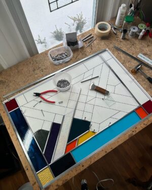 Ivy Winters Instagram - Hello everyone! I hope everyone has been staying happy and healthy this winter season!I’ve been pretty busy making stained glass panels and wanted to share with you my latest commission piece. It’s 31” by 21” with a fun range of colors, textures and square bevels. It has been recently installed in my clients laundry room (last picture). #stainedglass #leadwindow #lead #glass #glasscutter #beveledglass #art #window #handmade