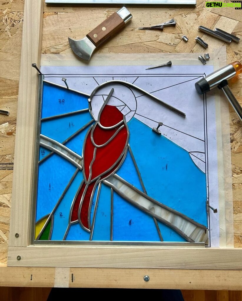 Ivy Winters Instagram - A cardinal panel I created for my cousin ❤️ I enjoyed making this piece for her. I included a little video of the cementing process. It was a breezy cold day and my wind-chimes were just a singing ❤️ #cardinal #stainedglass #leadedwindow #cement #windchimes