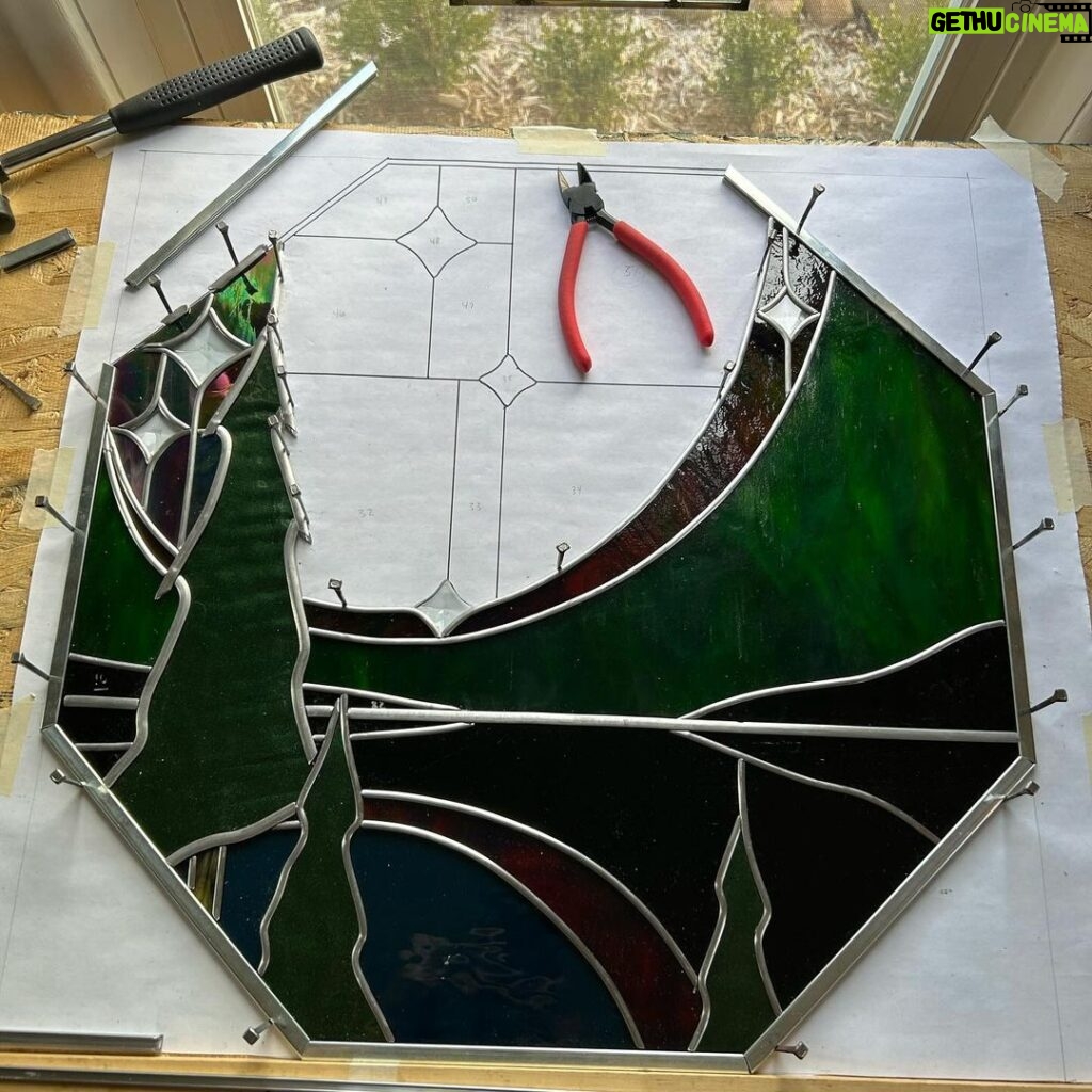 Ivy Winters Instagram - I had a fun time making this northern lights window for my folks house. Each beveled star represents a direct member of our family. So happy how it fit right into the octagon frame as this was my first octagon window! Jamin out to #gilbertosullivan #stainedglass #leadedwindow #forrest #northernlights #antiqueglass