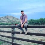 Jake Helgren Instagram - You can take the boy outta the country… But you can’t keep him from country summer sunsets & climbing fences (or 4 story-high windmills haha). Scroll => for 40 feet above action! . . . #directorlife🎬🎥 #ninthhousefilms #throwbackthursday Rancho San Cayetano