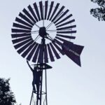 Jake Helgren Instagram - You can take the boy outta the country… But you can’t keep him from country summer sunsets & climbing fences (or 4 story-high windmills haha). Scroll => for 40 feet above action! . . . #directorlife🎬🎥 #ninthhousefilms #throwbackthursday Rancho San Cayetano