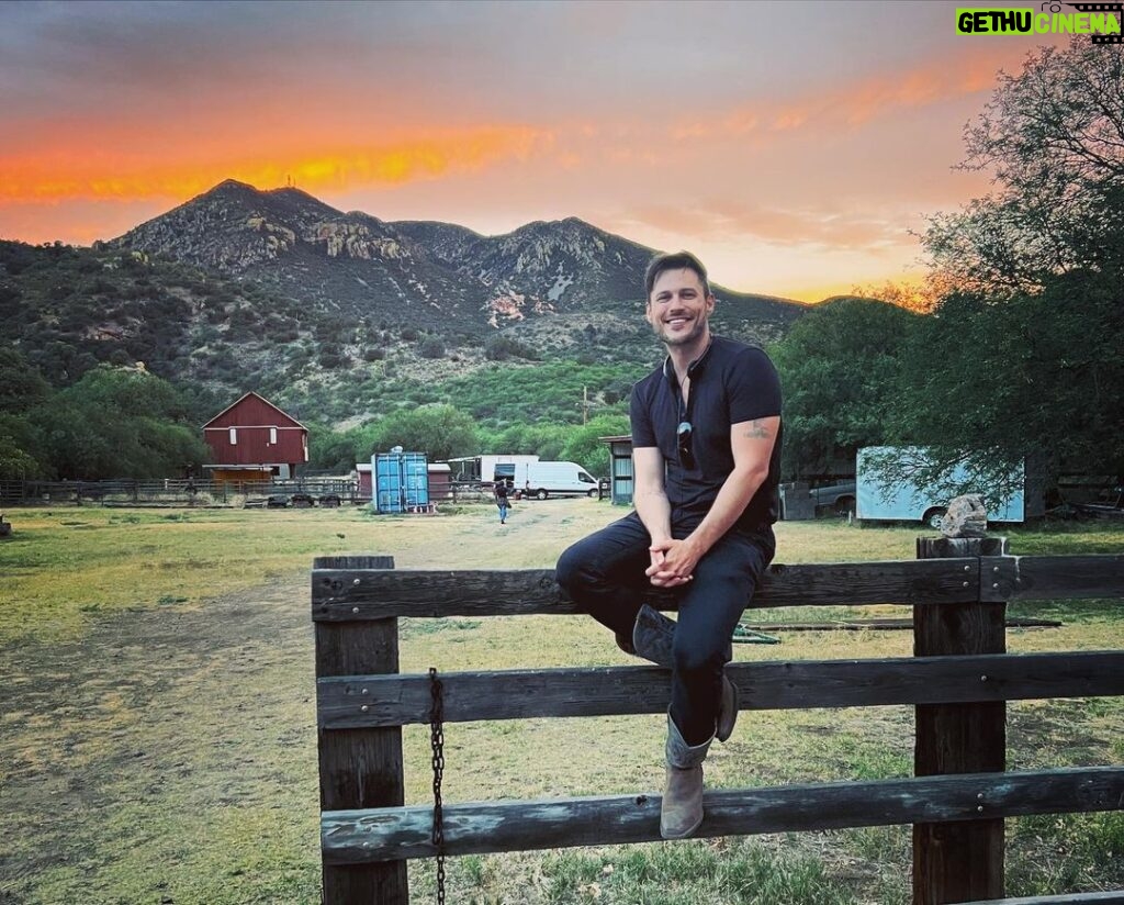 Jake Helgren Instagram - You can take the boy outta the country… But you can’t keep him from country summer sunsets & climbing fences (or 4 story-high windmills haha). Scroll => for 40 feet above action! . . . #directorlife🎬🎥 #ninthhousefilms #throwbackthursday Rancho San Cayetano