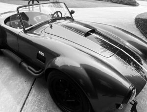 Jeffrey Dean Morgan Instagram - Man… my mistress here. Just can’t NOT smile driving her! Kids as obsessed as I am. I’ve wanted a cobra my entire life. Had a photo of one on wall of childhood bedroom. Now? Well? I walk out to garage and stare. Nothing more fun on these Georgia backroads. @backdraft_racing makes one hell of a vehicle. @earthmotorcars and @trevor.i.lewis thank you guys for putting this all together for me. It was a long haul, but so worth it! Can’t tell you how much I appreciated the time, or how much we love this car! Even @hilarieburton can’t hide her smile! (It kills her to like it!) also… thanks for the kicks @fkc_mooneyes_spain!! Y’all have a great week. I’m gonna go drive. Xojd